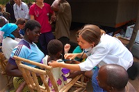 Doctor examins girl at Senga Bay